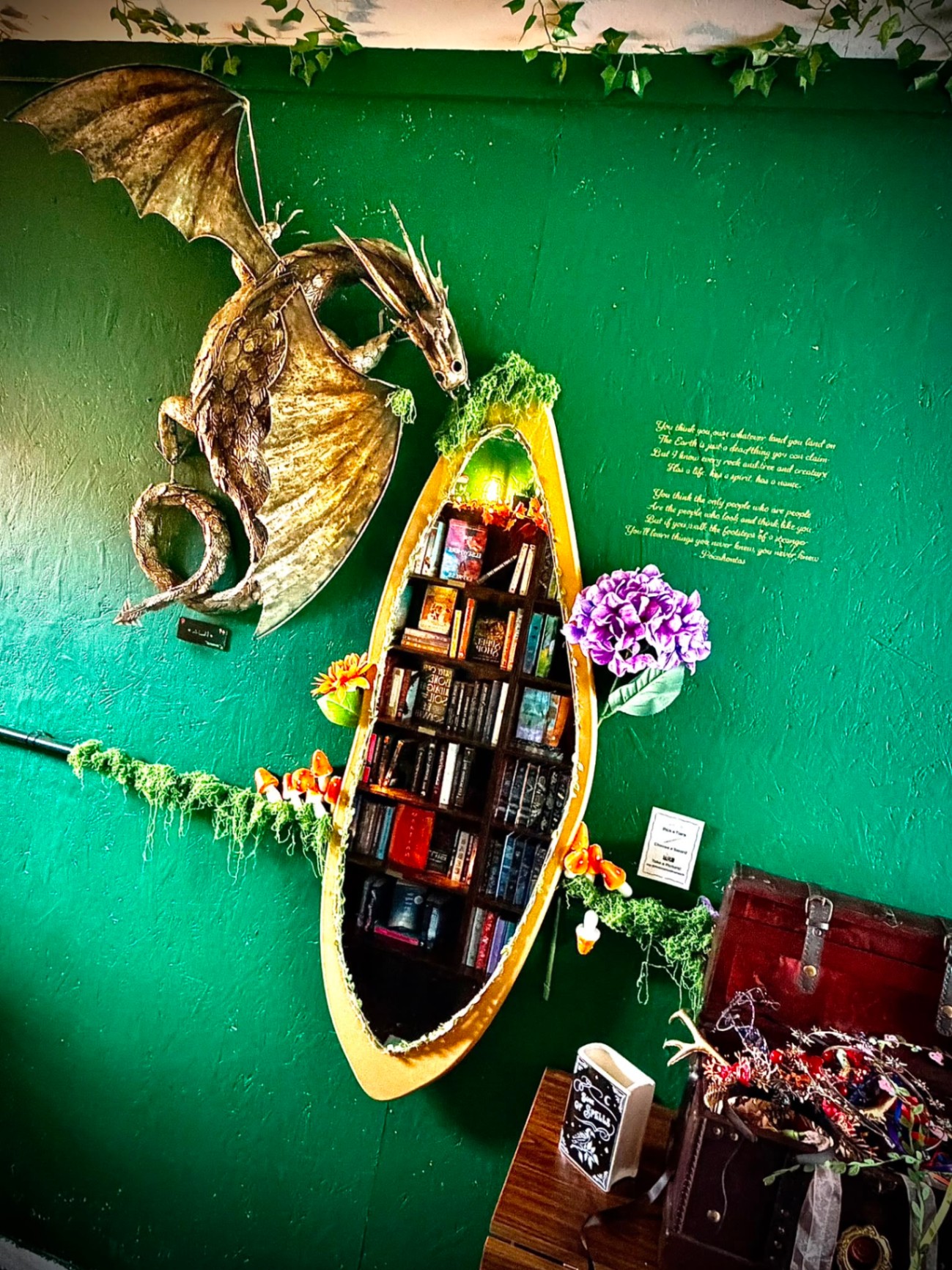 Dragon sculpture beside the boat bookshelf